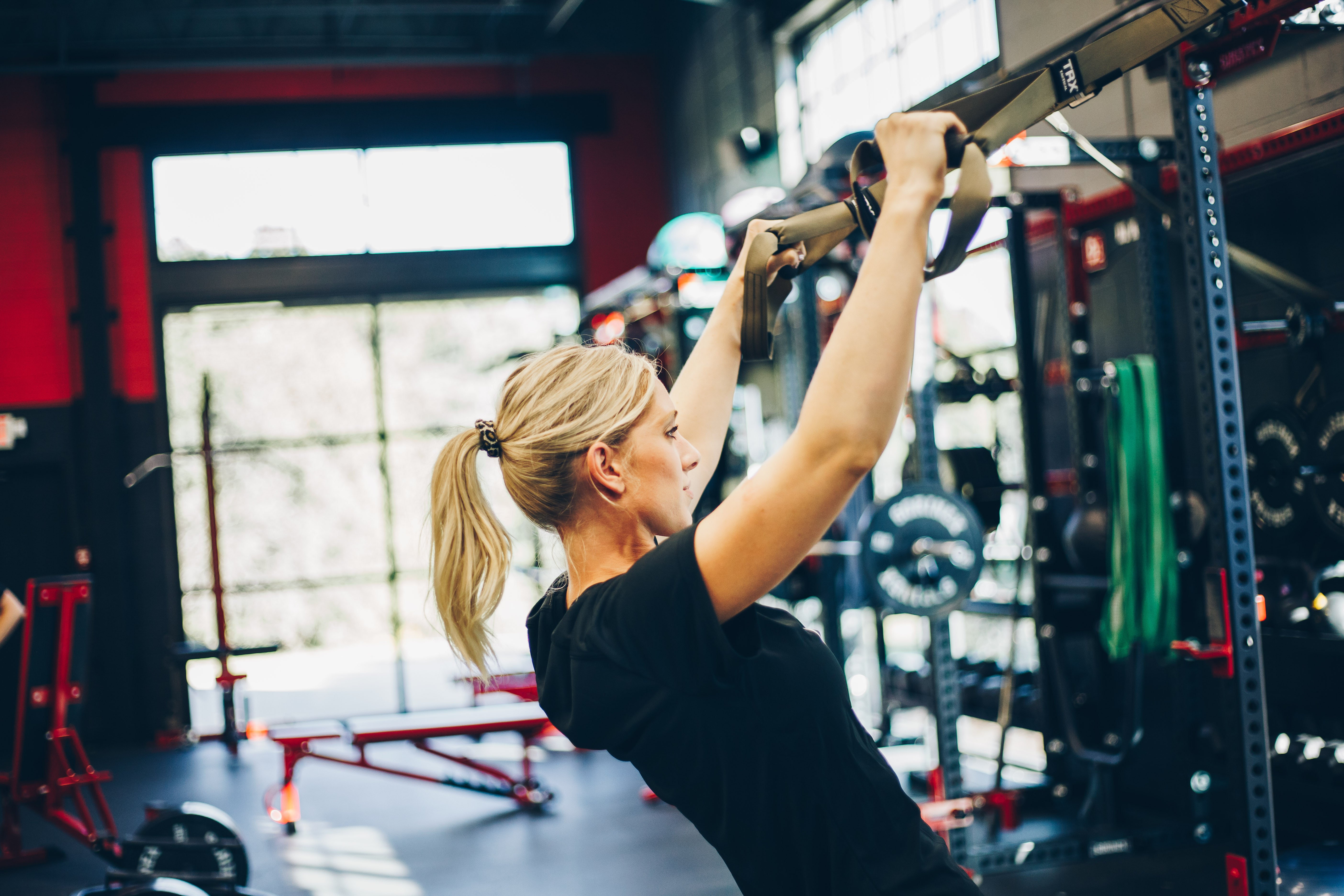 Girl on pull-up bar